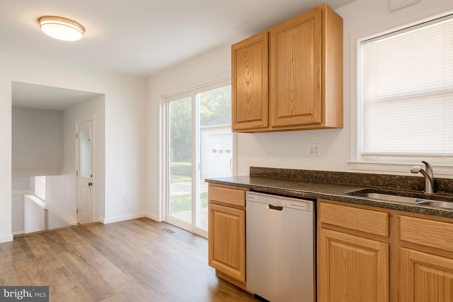 209 Warfield Road Newark, DE 19713 - Photo 8 of 18 a kitchen with granite countertop cabinets stainless steel appliances a sink and a window