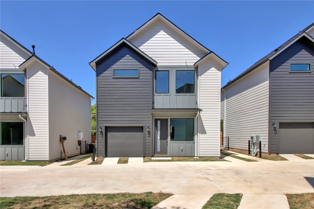 1140 Webberville Road, Unit 3 Austin, TX 78721 - Photo 1 of 1 a front view of a house with a garage