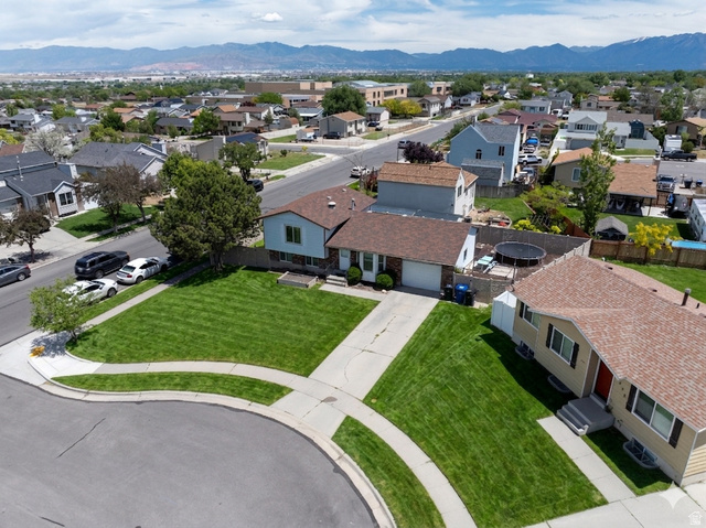 3689 Lasso Loop Circle Magna, UT 84044 - Photo 21 of 26 Ai enhanced Aerial perspective featuring suburban neighborhood with distant mountains