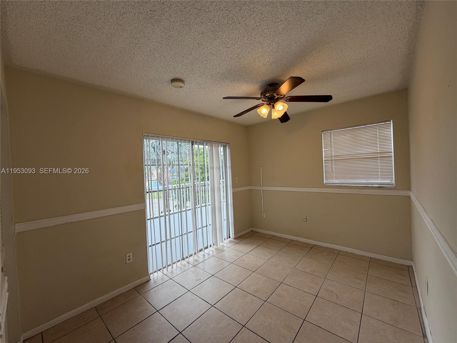 9503 Southwest 88th Terrace, Unit 9503 Miami, FL 33176 - Photo 9 of 15 a view of an empty room with a window