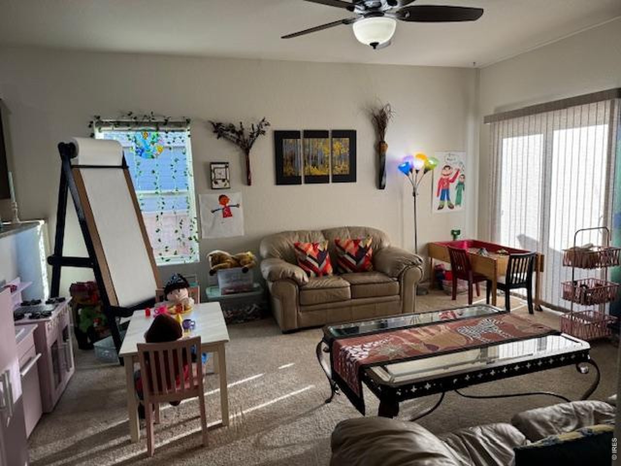 2865 Big Thunder Road Berthoud, CO 80513 - Photo 11 of 35 a living room with furniture and a flat screen tv