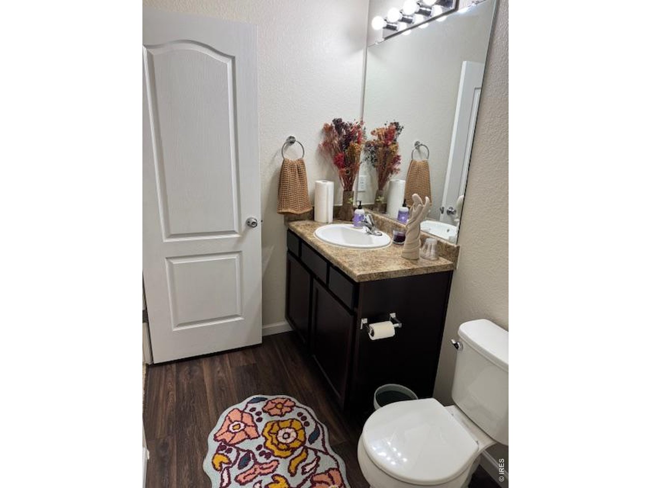 2865 Big Thunder Road Berthoud, CO 80513 - Photo 16 of 35 a bathroom with a toilet sink and mirror