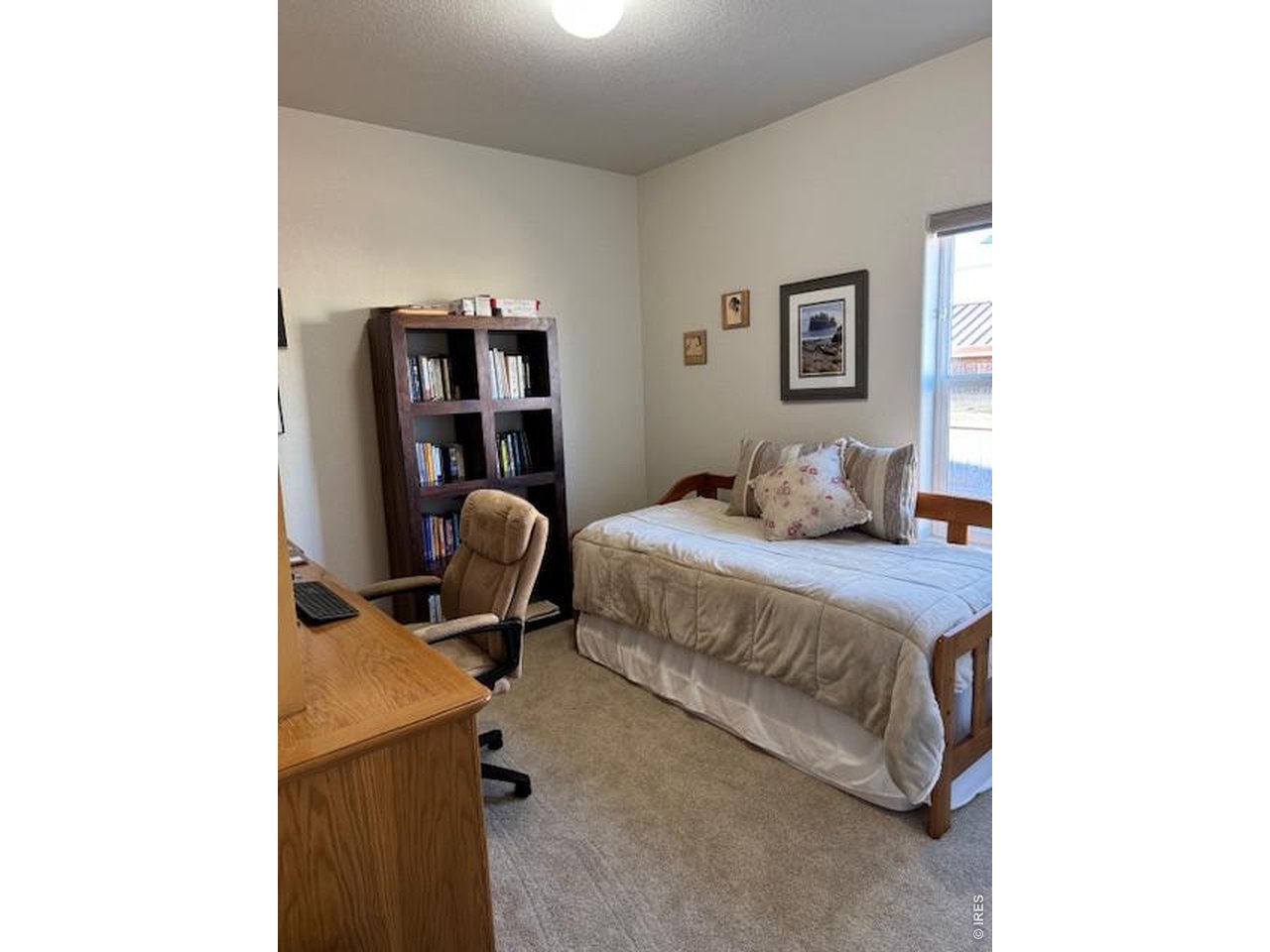 2865 Big Thunder Road Berthoud, CO 80513 - Photo 18 of 35 a bedroom with a bed and cabinets