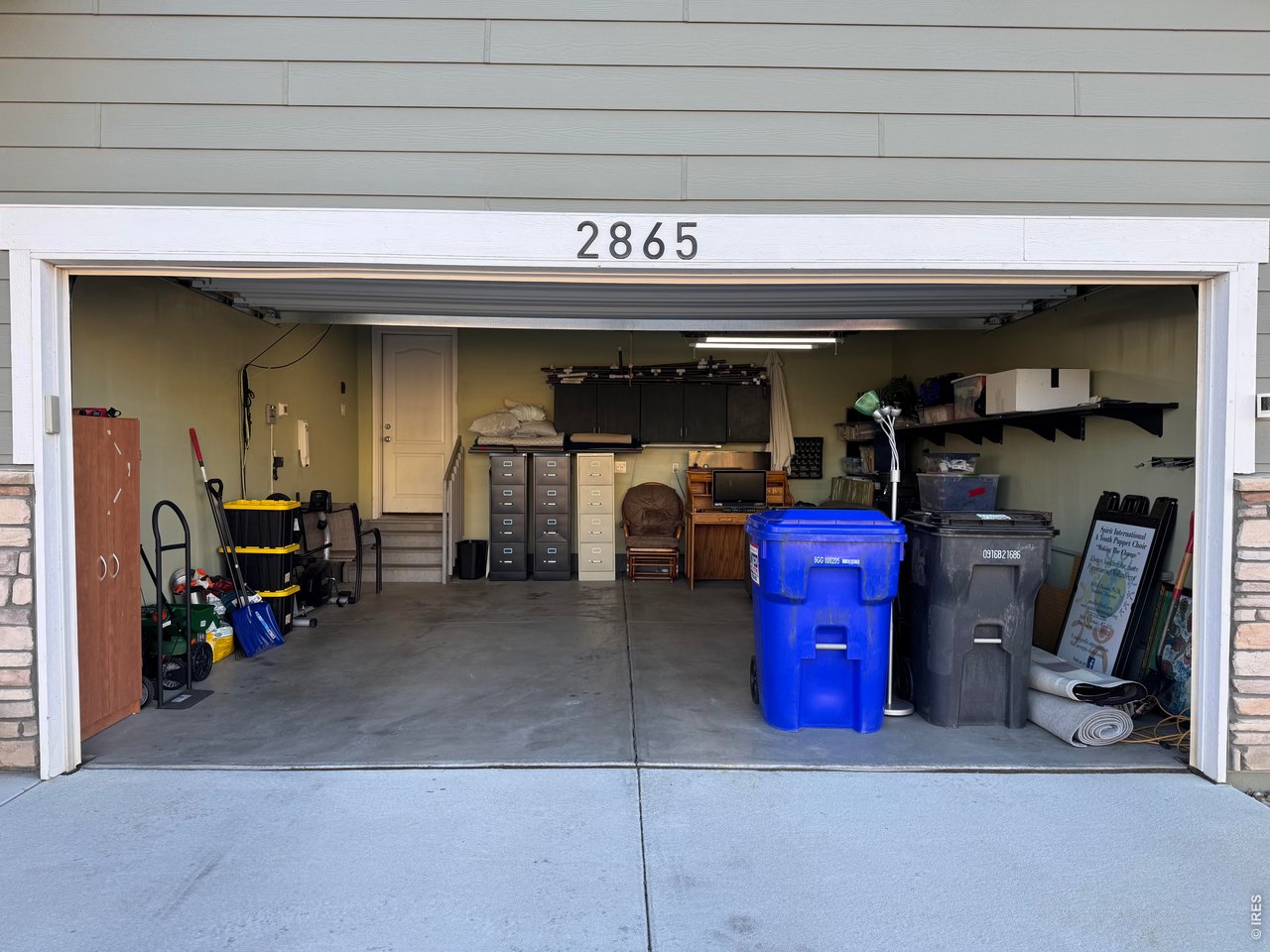 2865 Big Thunder Road Berthoud, CO 80513 - Photo 2 of 35 a view of a storage room with a lot of stuff
