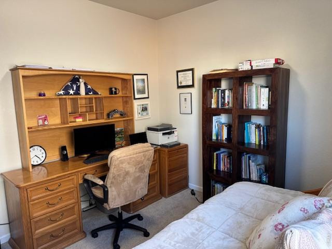 2865 Big Thunder Road Berthoud, CO 80513 - Photo 21 of 35 a bedroom with furniture and a book shelf