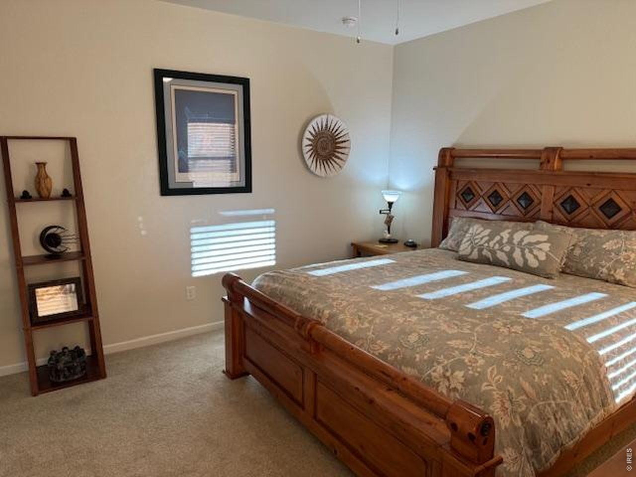 2865 Big Thunder Road Berthoud, CO 80513 - Photo 24 of 35 a bedroom with a bed and a window