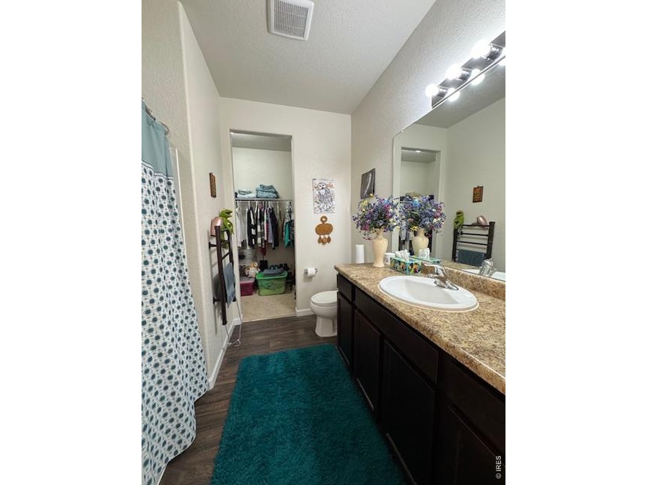 2865 Big Thunder Road Berthoud, CO 80513 - Photo 28 of 35 a bathroom with a sink double vanity granite and a shower