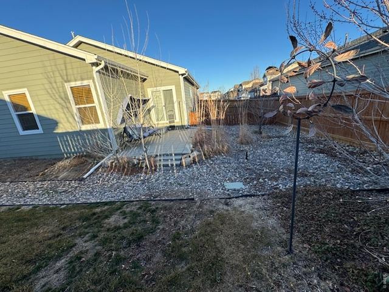 2865 Big Thunder Road Berthoud, CO 80513 - Photo 35 of 35 a view of a house with a backyard