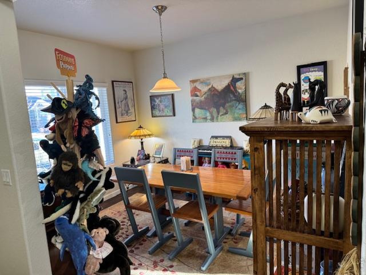 2865 Big Thunder Road Berthoud, CO 80513 - Photo 6 of 35 a view of a dining room with furniture and chandelier