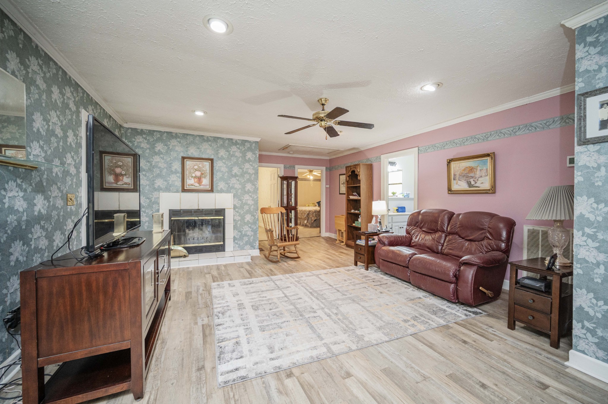 145 Crenshaw Road Bethpage, TN 37022 - Photo 7 of 44 a living room with furniture and a fireplace