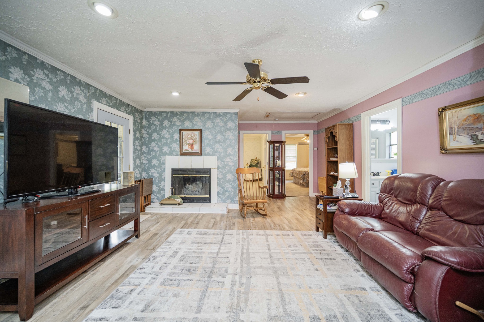 145 Crenshaw Road Bethpage, TN 37022 - Photo 8 of 44 a living room with furniture a flat screen tv and a fireplace