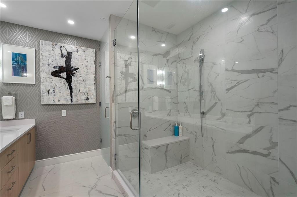 2425 Peachtree Street Northeast, Unit 707 Atlanta, GA 30305 - Photo 22 of 39 a bathroom with a shower and a sink