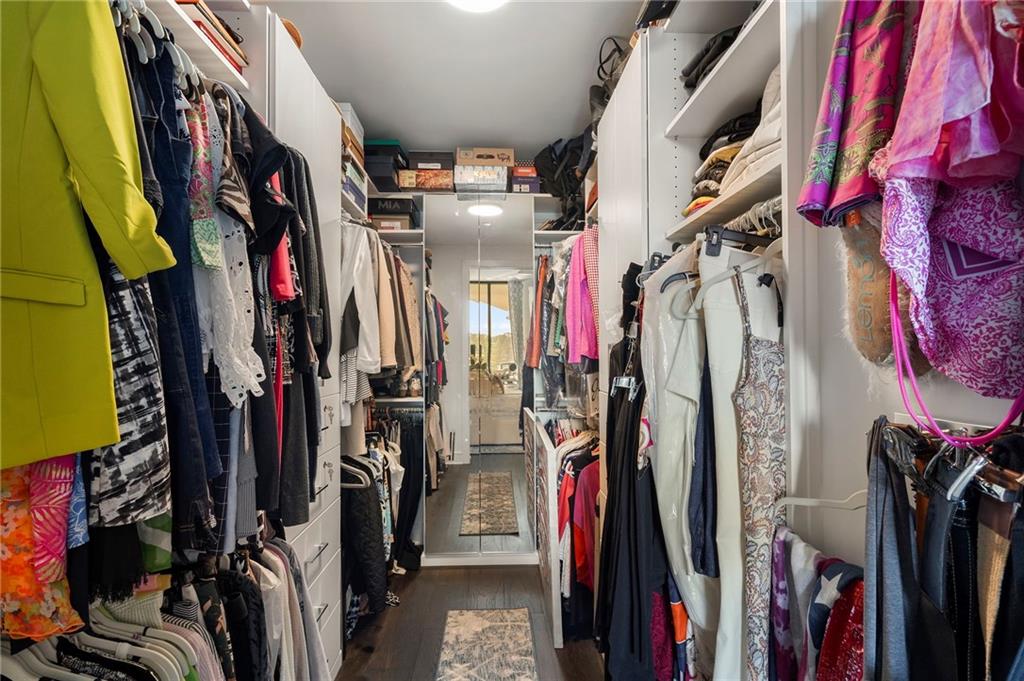 2425 Peachtree Street Northeast, Unit 707 Atlanta, GA 30305 - Photo 23 of 39 a view of walk in closet with clothes