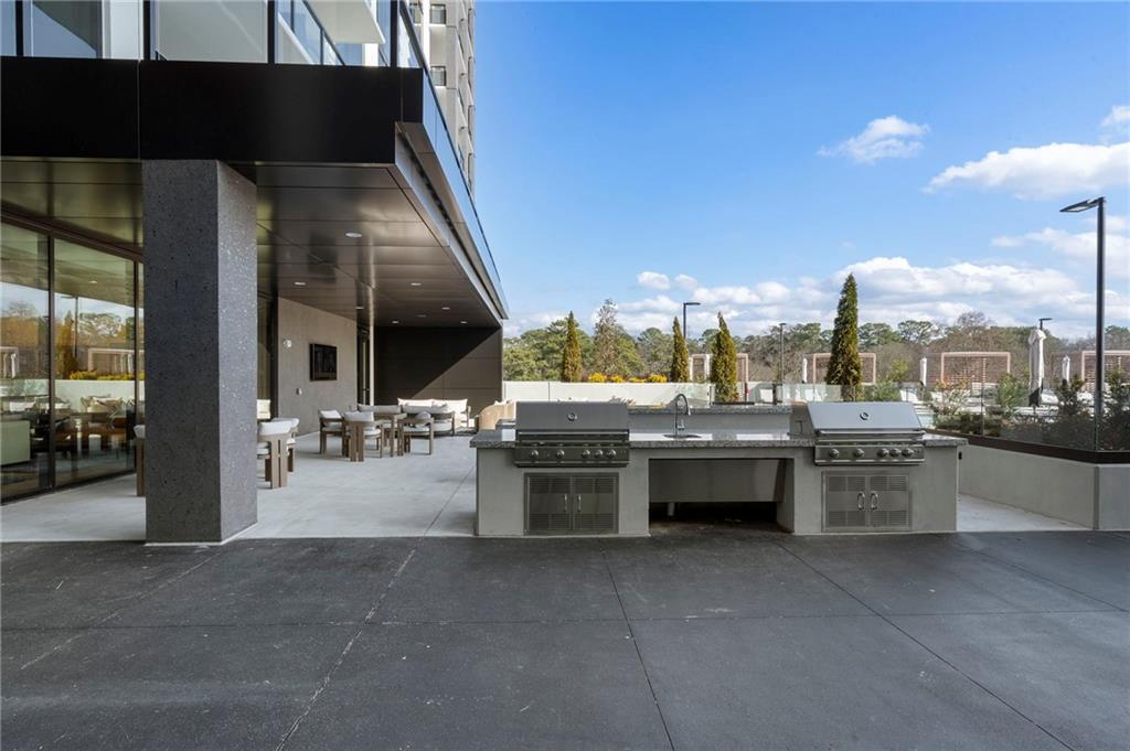 2425 Peachtree Street Northeast, Unit 707 Atlanta, GA 30305 - Photo 31 of 39 a large building with a view of living room and couches
