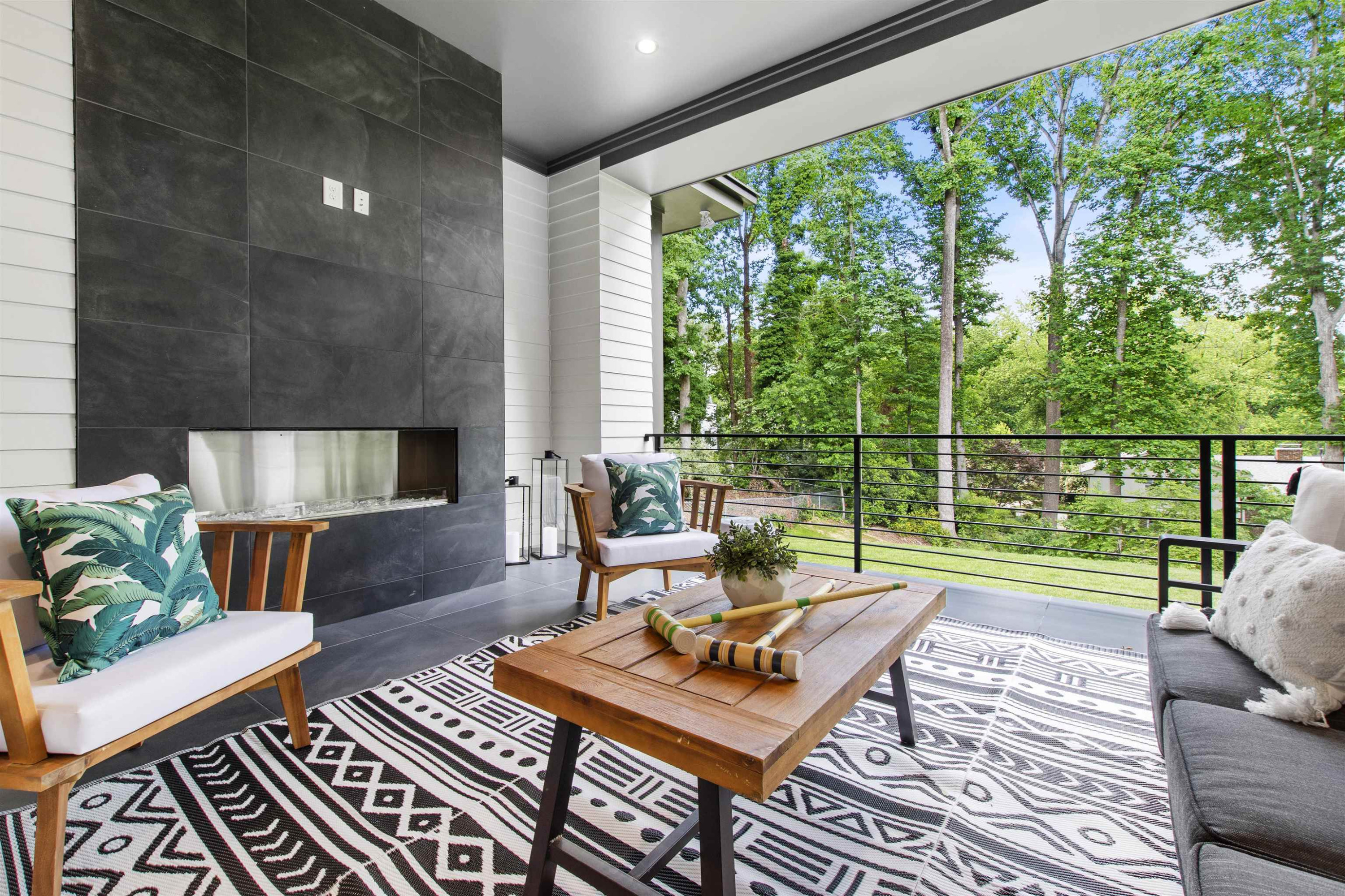3340 Hampton Road Raleigh, NC 27607 - Photo 59 of 66 With over 700 Square Feet of outdoor living space there is a seating area with an echelon fireplace that will warm you in the coldest months. Covered Patio