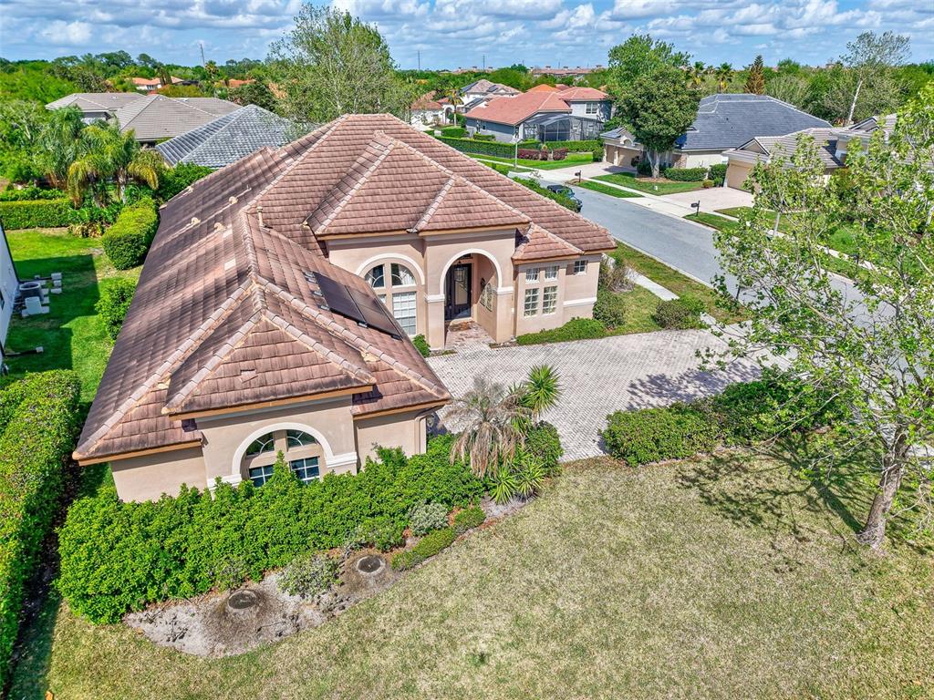918 Algare Loop Windermere, FL 34786 - Photo 69 of 73 a aerial view of a house with a yard and plants