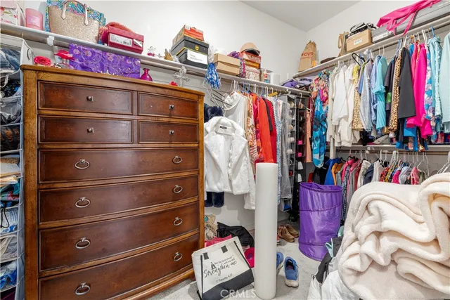 a bedroom with two beds and a window