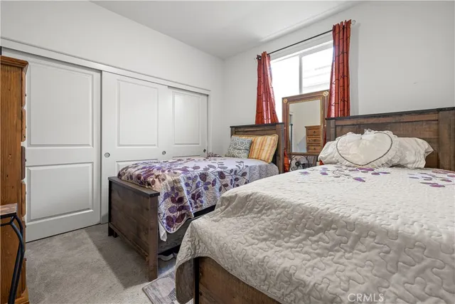a bathroom with a toilet a sink and a mirror