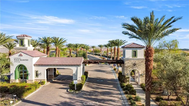 a front view of multiple houses with yard