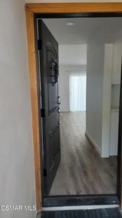 a view of a livingroom with wooden floor