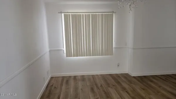 a bedroom with a bed and a stove top oven