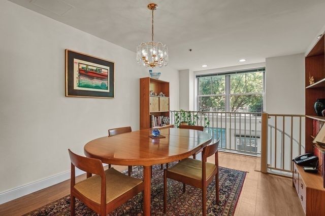 a dining room with furniture window wooden floor