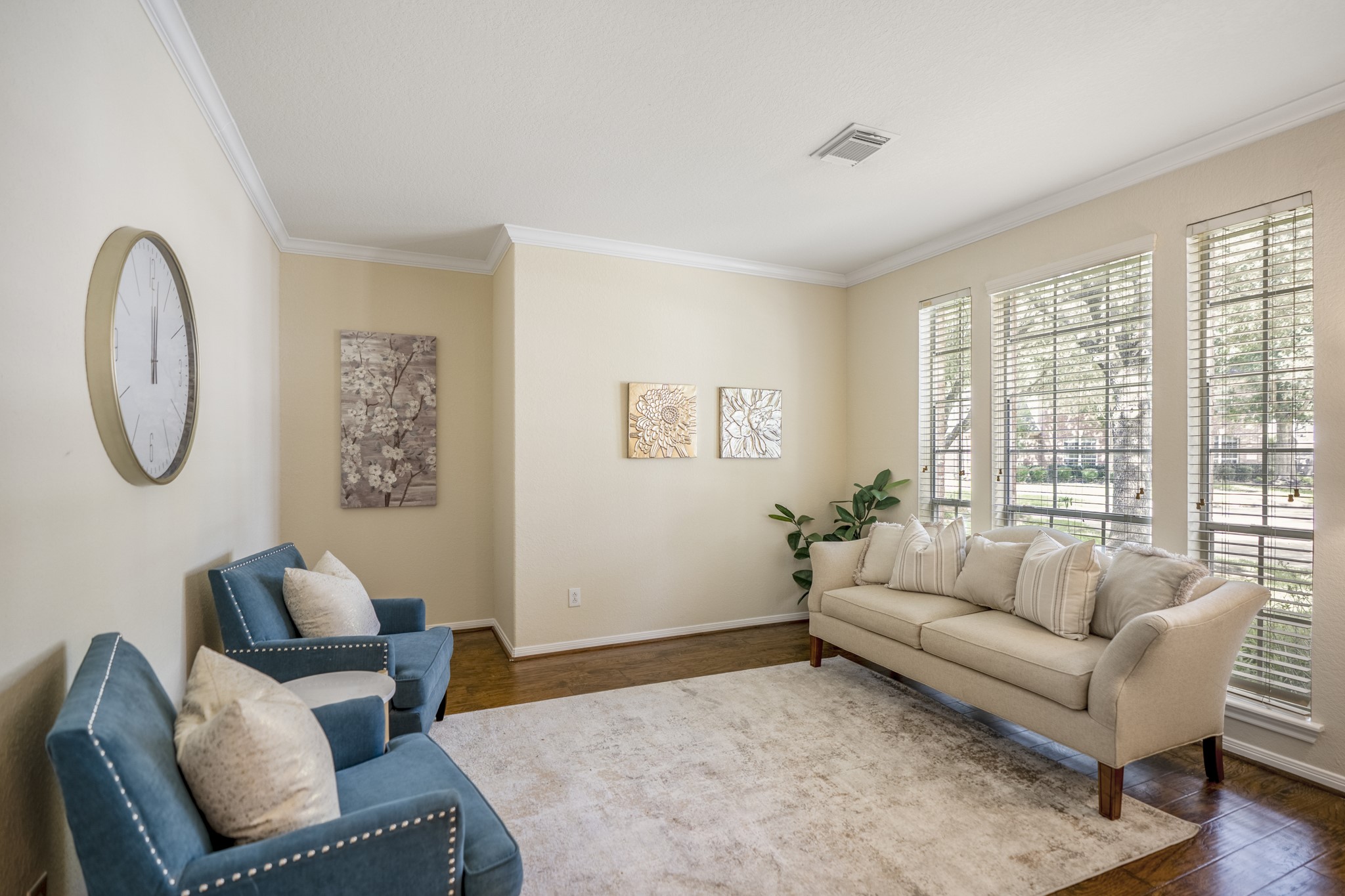 5807 Sequoia Trace Court Spring, TX 77379 - Photo 5 of 50 The formal living room sits just off the foyer, offering a bright front gathering space with laminate flooring, crown molding, and tall windows overlooking the shaded front lawn.