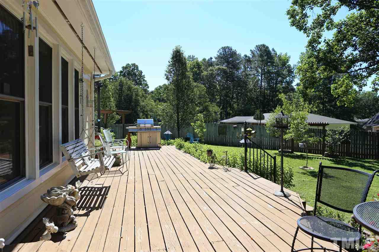 1809 Albacore Lane Raleigh, NC 27612 - Photo 17 of 25 a view of a patio with couches table and chairs and potted plants