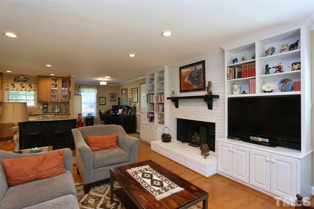 1809 Albacore Lane Raleigh, NC 27612 - Photo 6 of 25 a living room with furniture and a flat screen tv