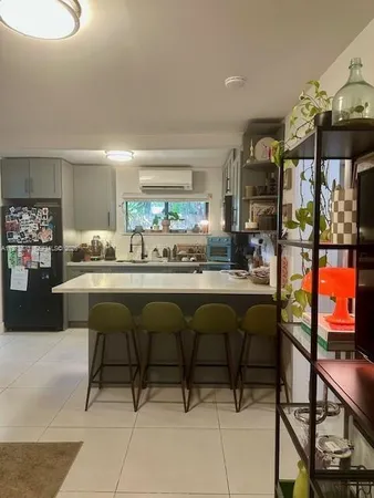 a living room with a table and chairs