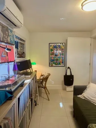 a view of a workspace with furniture and a couch