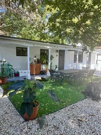 a backyard of a house with seating space