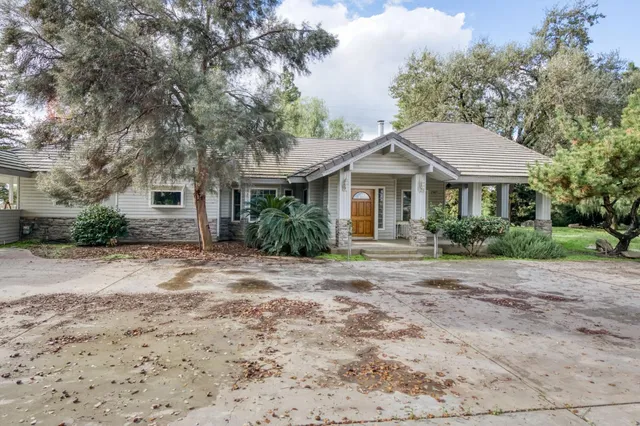 a front view of house with small garden