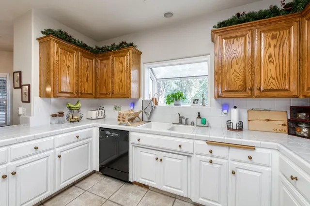a large kitchen with a large window