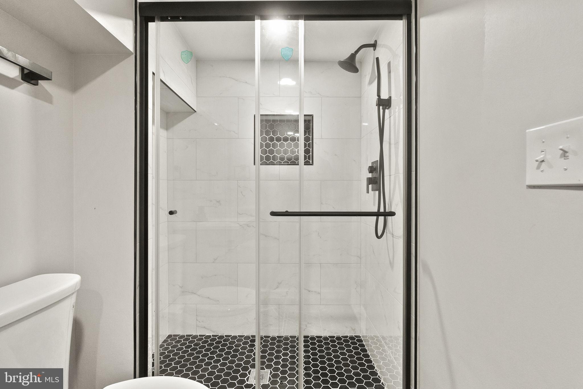 6314 7th Street Northwest Washington, DC 20011 - Photo 14 of 19 a bathroom with a shower and a toilet