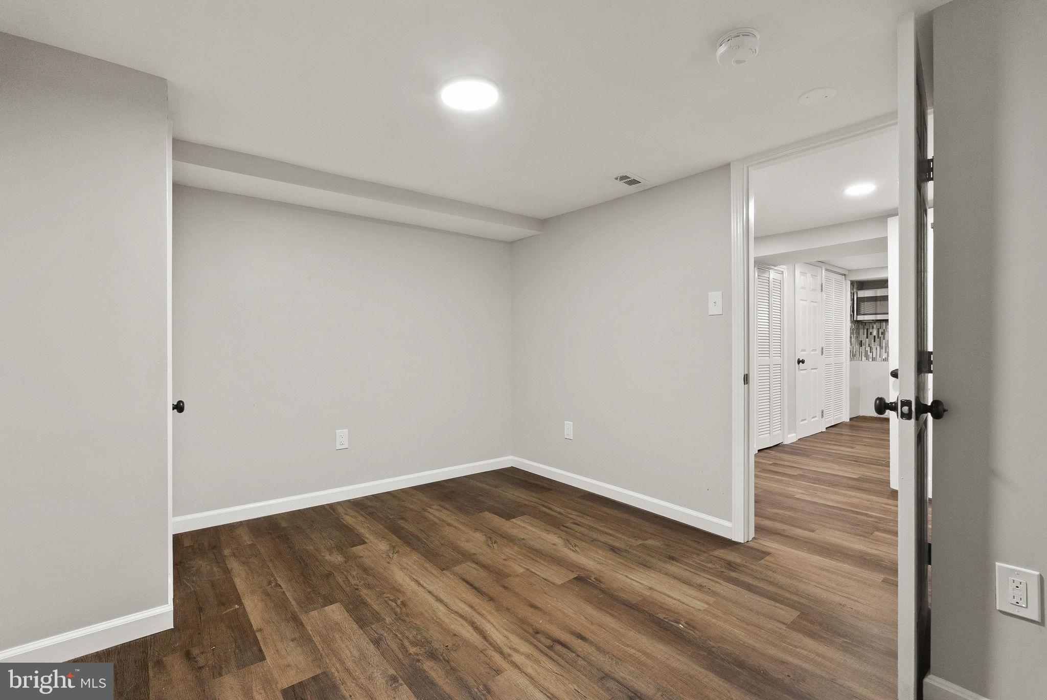 6314 7th Street Northwest Washington, DC 20011 - Photo 6 of 19 a view of an empty room with wooden floor