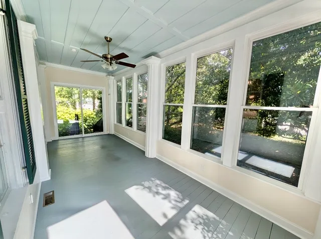a view of hallway with furniture and a window