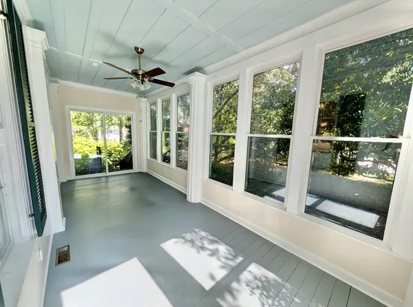 a view of hallway with furniture and a window