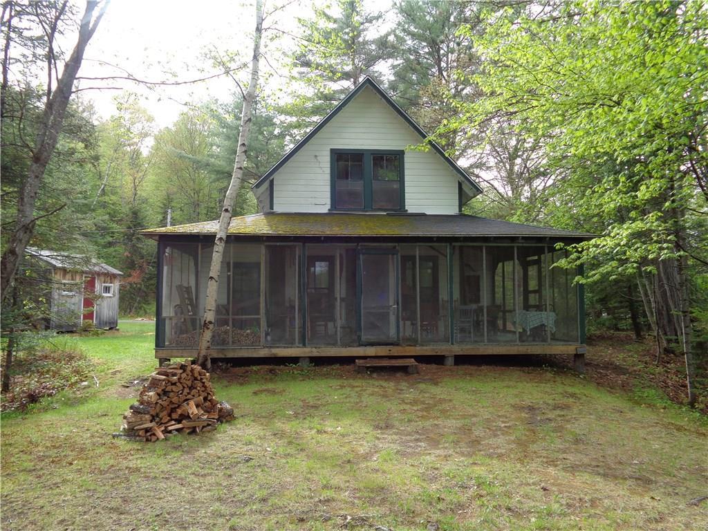 1007 Sebec Lake Road Willimantic, ME 04443 - Photo 1 of 12 Quaint cottage with wrap around...
