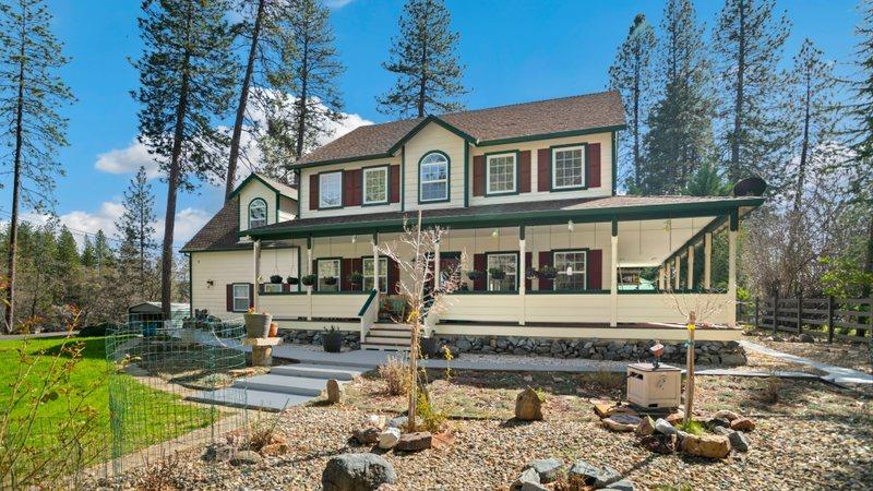 a front view of a house with garden
