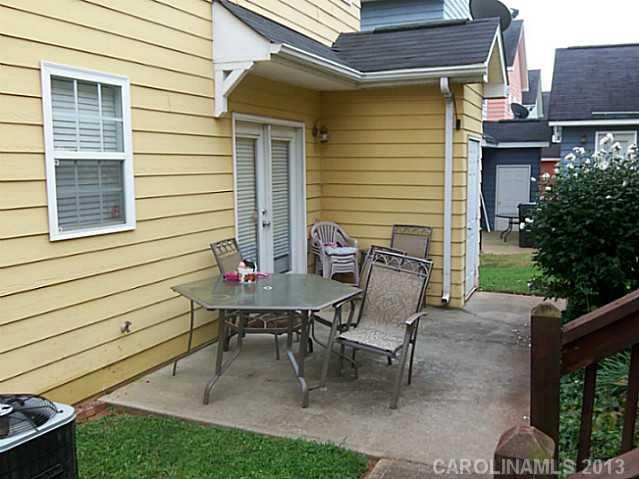 8236 Townley Road Huntersville, NC 28078 - Photo 5 of 10 a view of a chair and table in backyard of the house