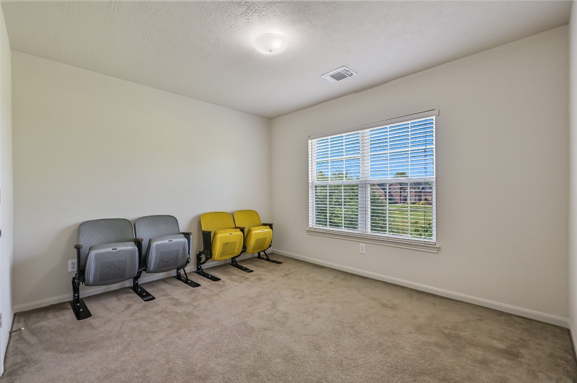 1404 Hollier Road Friendswood, TX 77546 - Photo 29 of 46 A third secondary bedroom provides a generous footprint with plenty of wall space and natural light. The layout works well for a variety of uses depending on your needs.