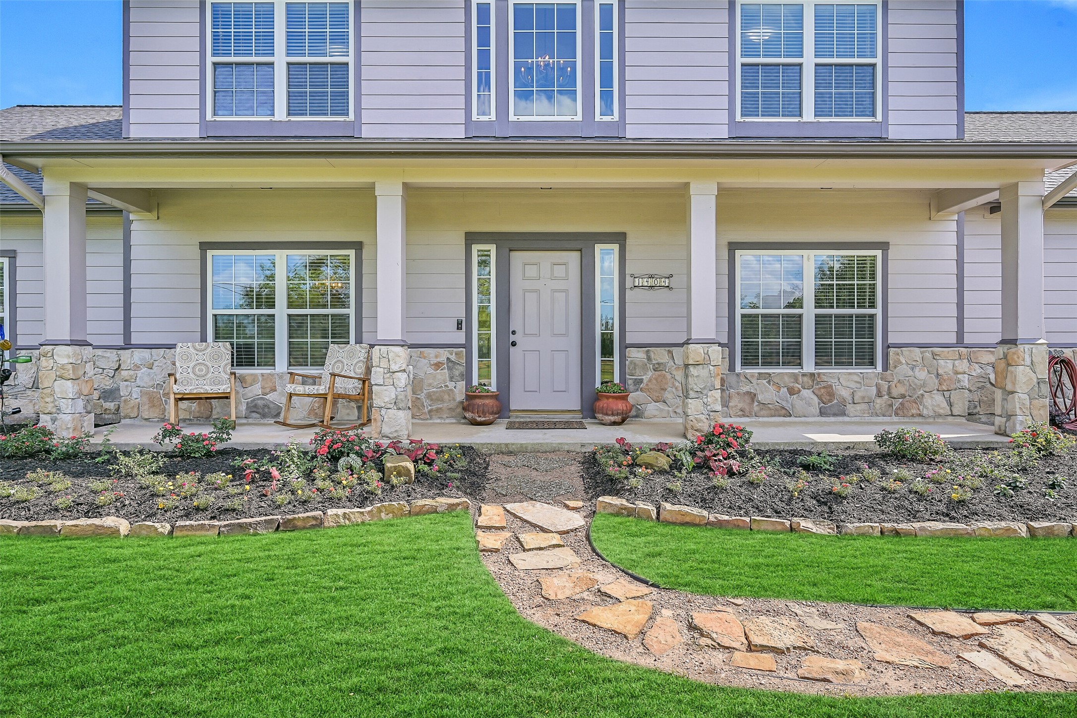 1404 Hollier Road Friendswood, TX 77546 - Photo 6 of 46 Follow the stone walkway to an adorable covered front porch framed by refreshed landscaping and natural stone accents. This welcoming entry sets the tone for the home’s thoughtful updates and relaxed country feel.
