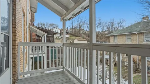 a view of a street from a balcony