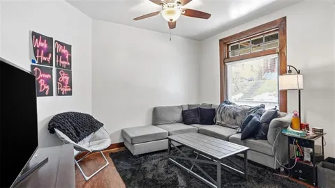 a living room with furniture and a window