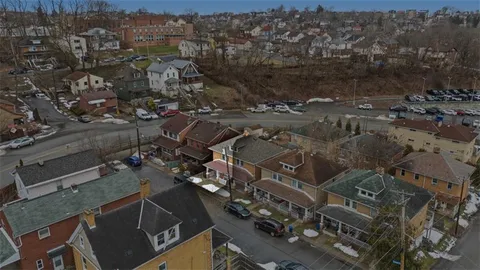 an aerial view of a city with lots of residential buildings