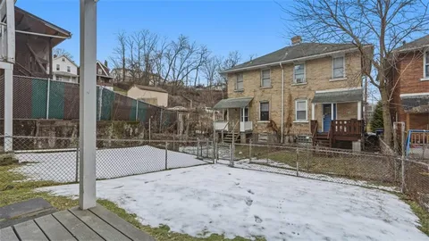 a view of house with a yard
