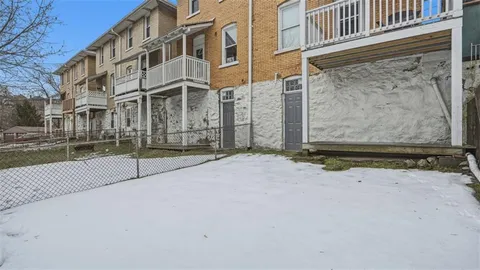 a view of a brick building with many windows