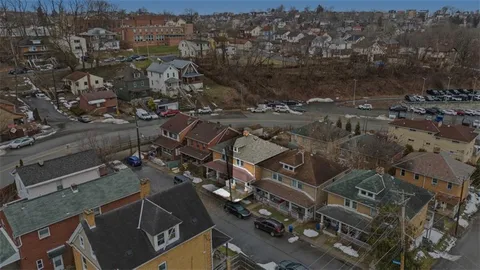 an aerial view of a city with lots of residential buildings