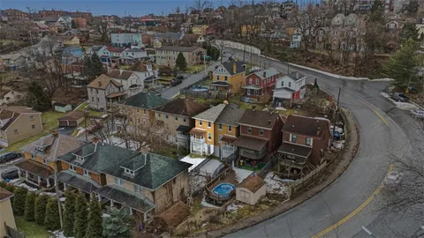 an aerial view of a highlighted house